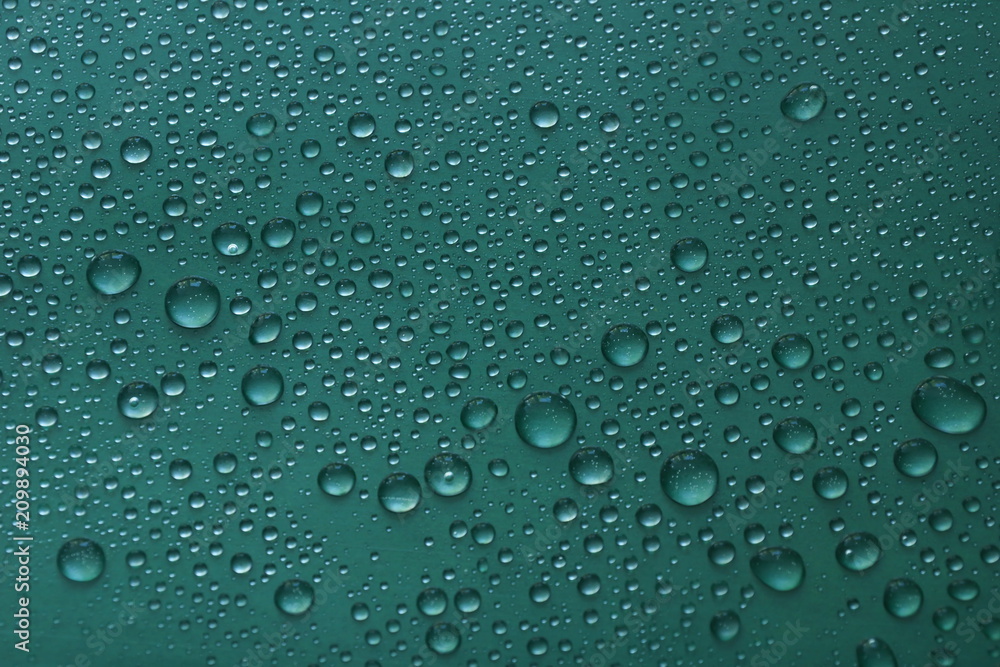 water drops on green background texture water drops on green background texture