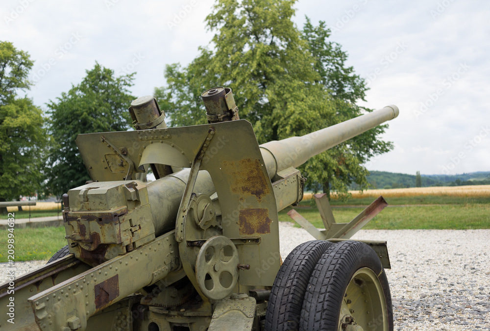 Old vintage mobile artillery vehicle - mobile military weapon with cannon. Armament from second world war. Gun is aiming to the sky