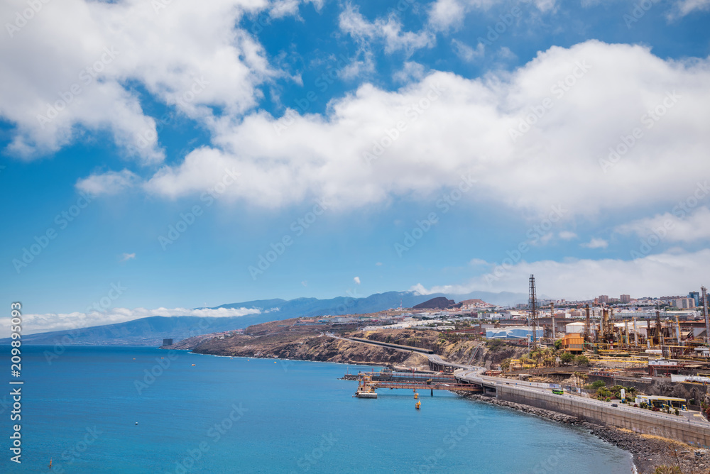 Santa Cruz de Tenerife coastline viewed from palmetum park, old refinery is in the background, Canary islands, Spain.