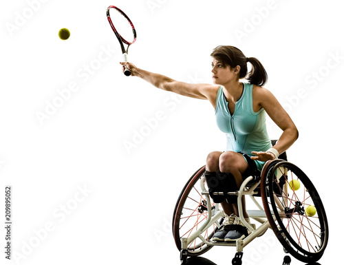 one caucasian young handicapped basket ball player woman in wheelchair sport tudio in silhouette isolated on white background