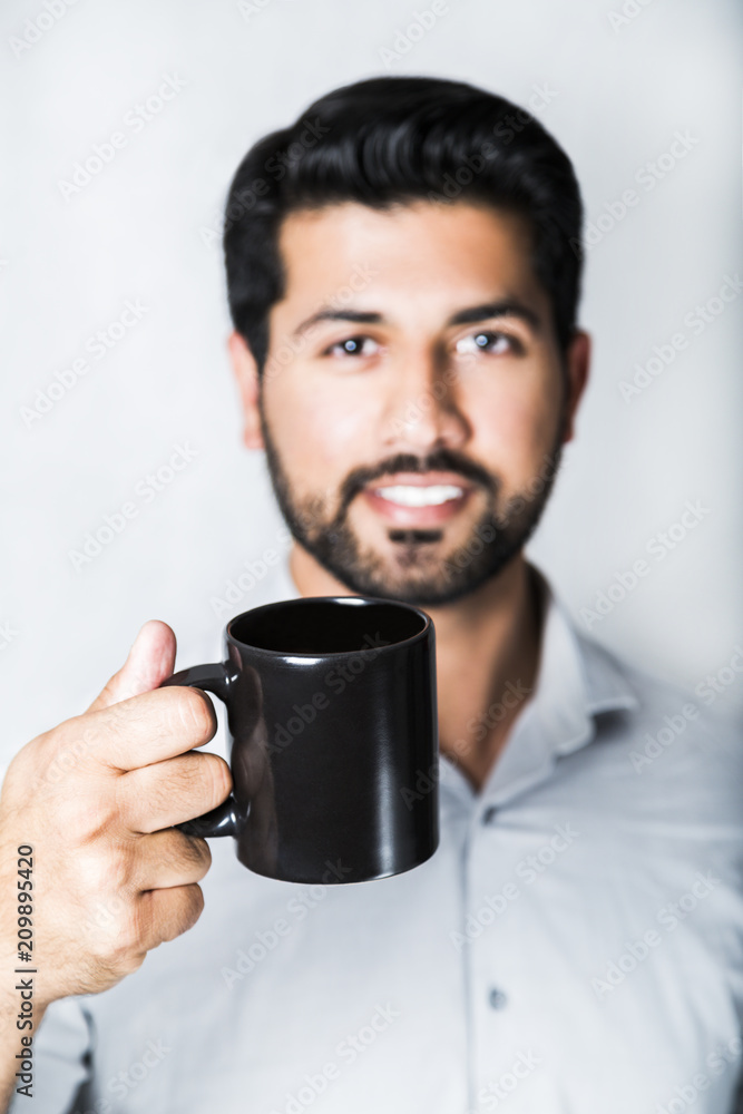 Arabic man in shirt with cup of coffee or tea Arabic man in shirt with cup of coffee or tea