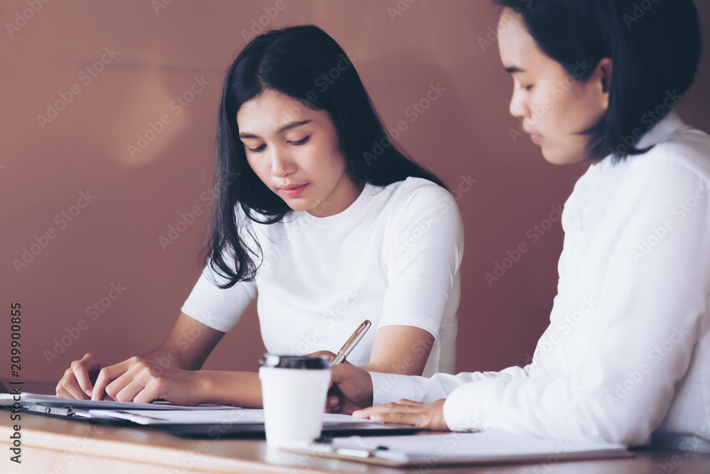 Businesswomen discussing seriously to documents and ideas at meeting,Teamwork concept Businesswomen discussing seriously to documents and ideas at meeting,Teamwork concept