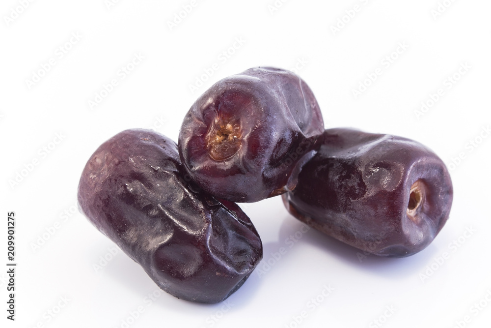 Three Ripe Dates Fruit Isolated on White Three Ripe Dates Fruit Isolated on White