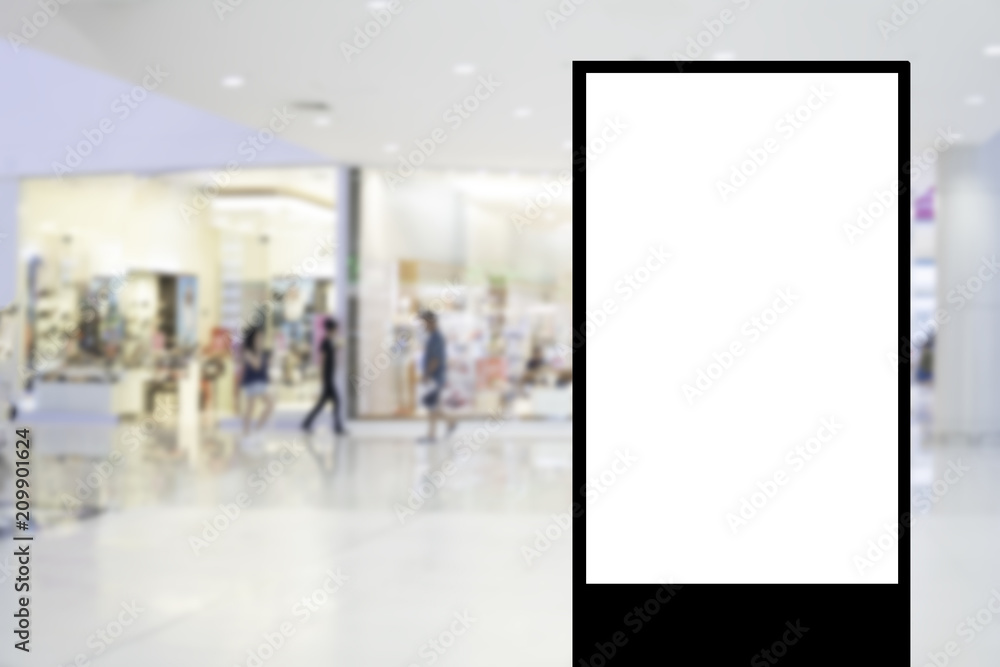 Blank billboard with copy space for your text message or content in shopping mall and luxury clothing derpartment store for background Blank billboard with copy space for your text message or content in shopping mall and luxury clothing derpartment store for background