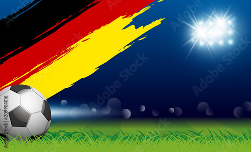 Soccer ball on grass and paintbrush germany flag in stadium with spotlight vector illustration © ArtBackground