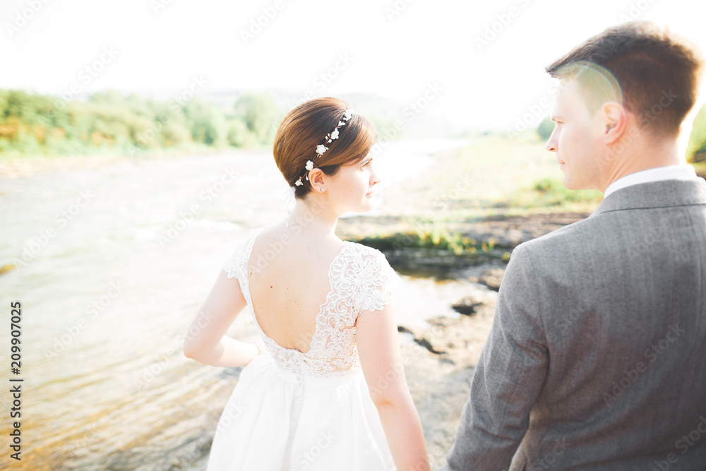 Wedding couple bride and groom holding hands Wedding couple bride and groom holding hands