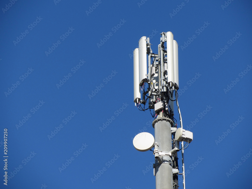 Telephone antenna on blue sky background Telephone antenna on blue sky background