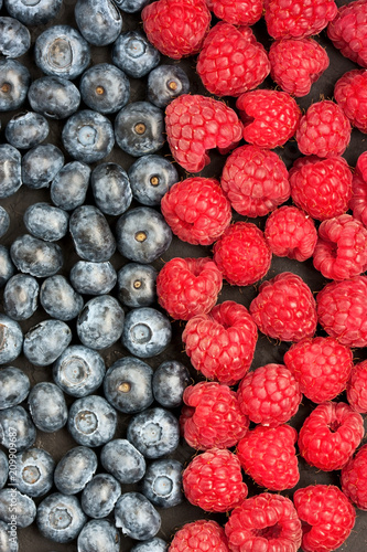 Blueberries and raspberries. Food background