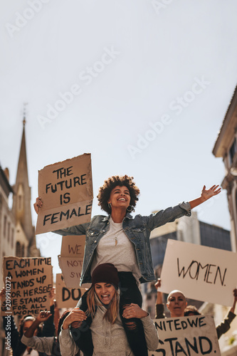 Female demonstrators enjoying the protest on road photo