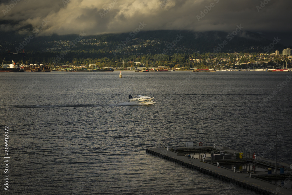Seaplane landing on water in Vancouver, Canada