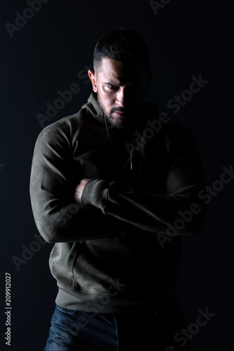 Sport fashion and style. Bearded man with hands folded in sweatshirt. Macho with beard wear casual clothes. Fashion model in stylish sportswear. Lifestyle for active and healthy man