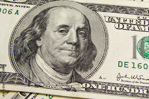 Front of the one hundred dollar bill with a Portrait of President Benjamin Franklin's close-up