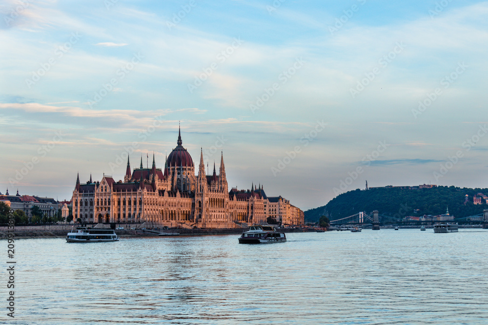 Fototapeta premium Hungarian parliament building in Budapest at sunset, view from the Danube river