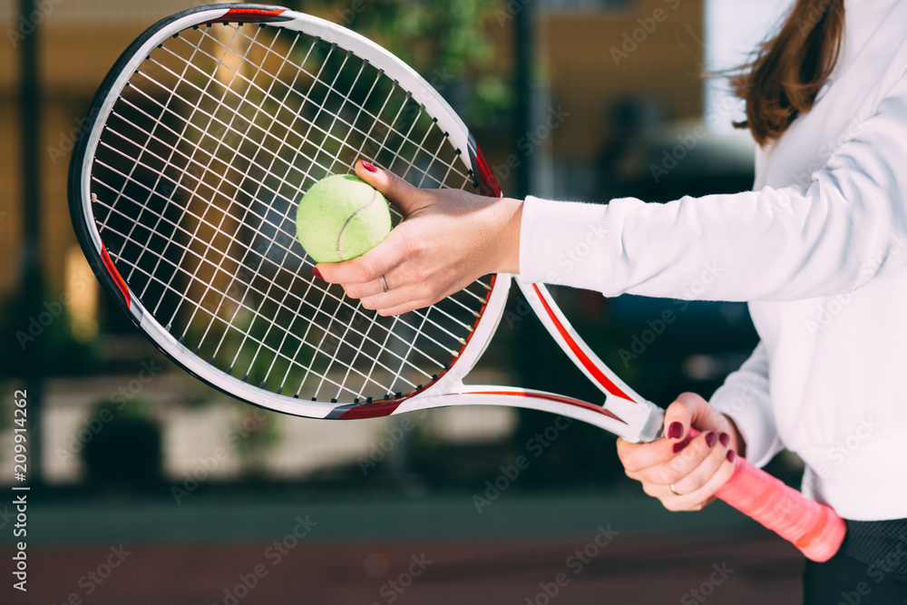female holding tennis ball and tennis racket, prepare to serve. tennis player starting set