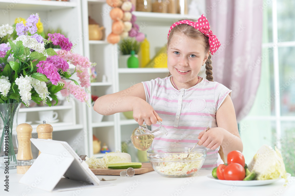 Cute girl preparing delicious fresh salad Cute girl preparing delicious fresh salad
