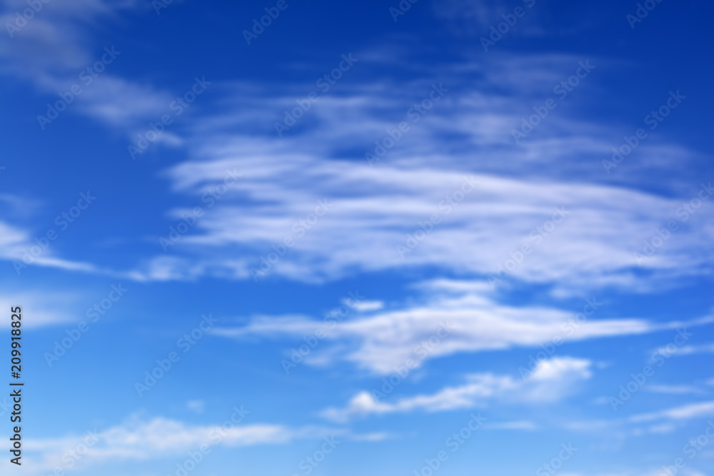 Blurred blue sky with clouds in summer sunny day