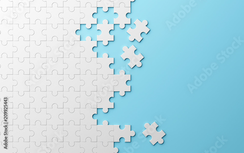 Jigsaw puzzle, pattern texture separated on blue background. 3d illustration photo