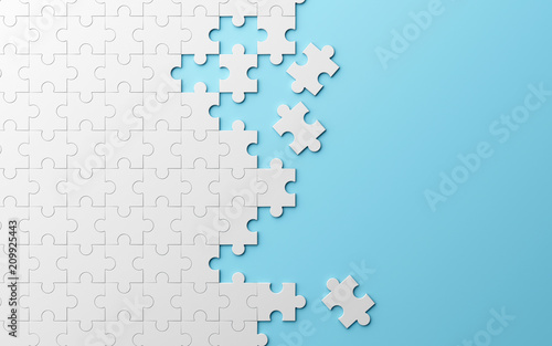 Фотография Jigsaw puzzle, pattern texture separated on blue background