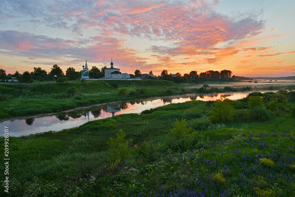 Naklejka premium Kideksha village landscape. View to the Church of Boris and Gleb from the Nerl river bank. It is one of the oldest church in Russia, built in 1152.