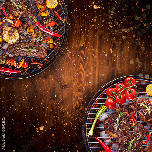 Barbecue grill with beef steaks, close-up.