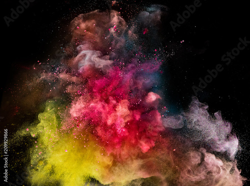 Colored powder explosion isolated on black background. © Lukas Gojda