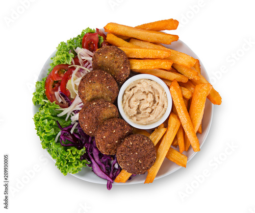 Falafel plate with fresh vegetables, hummus and french fries. photo