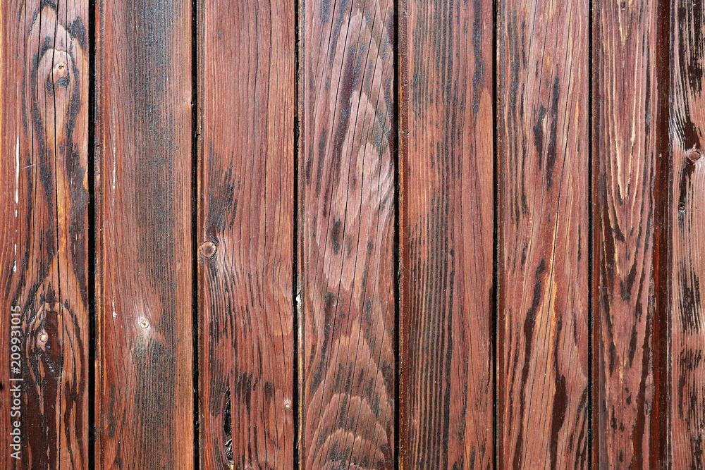 Naklejka premium Weathered deep-brown painted wooden board texture