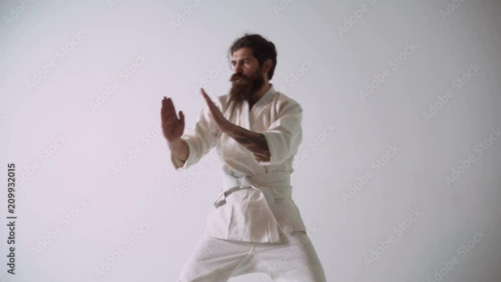 Funny handsome man fighting against moskito with awkward clumsy moves