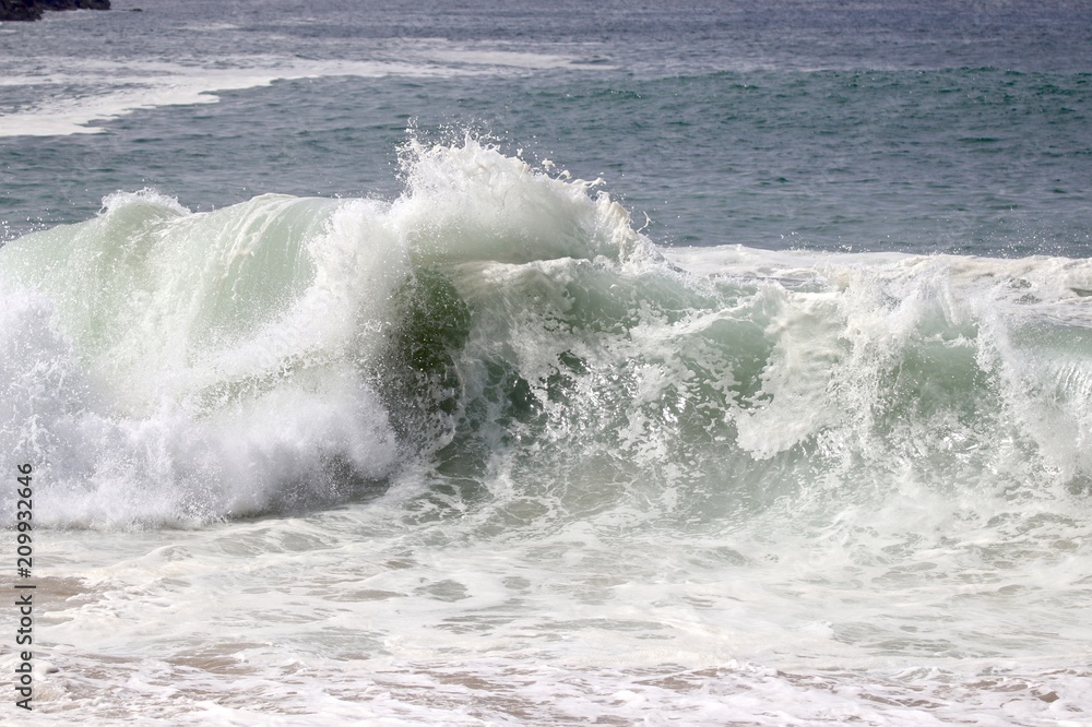 Large powerful wave crashing in the ocean Large powerful wave crashing in the ocean