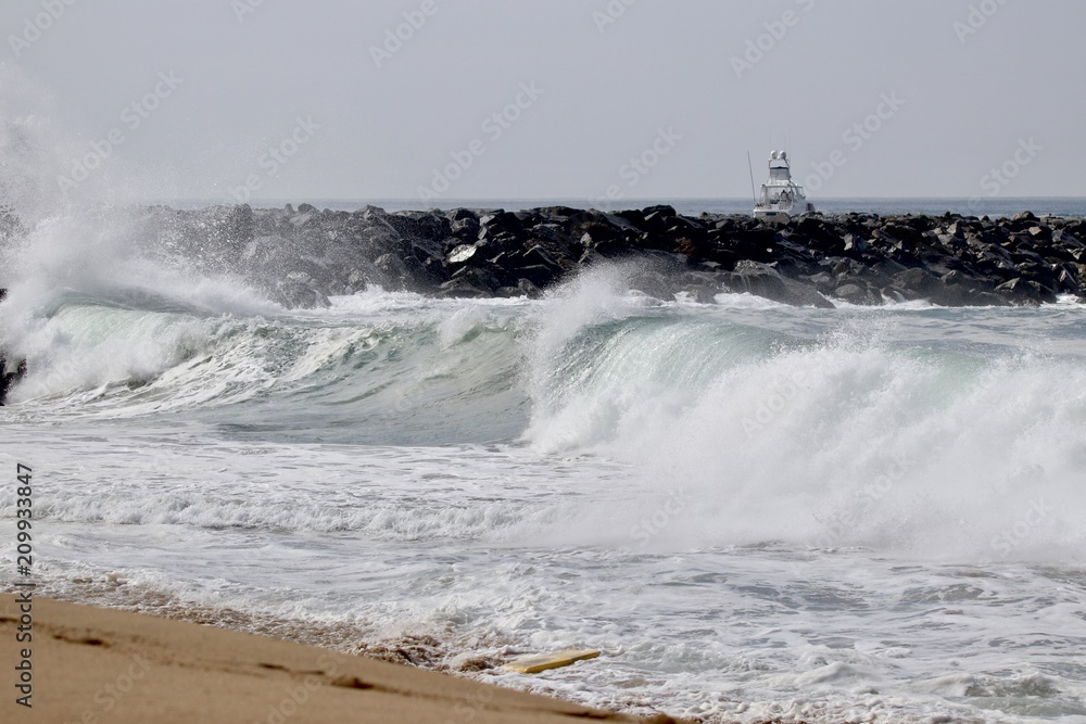 Large powerful wave crash at The Wedge in Newport Beach during a south swell 