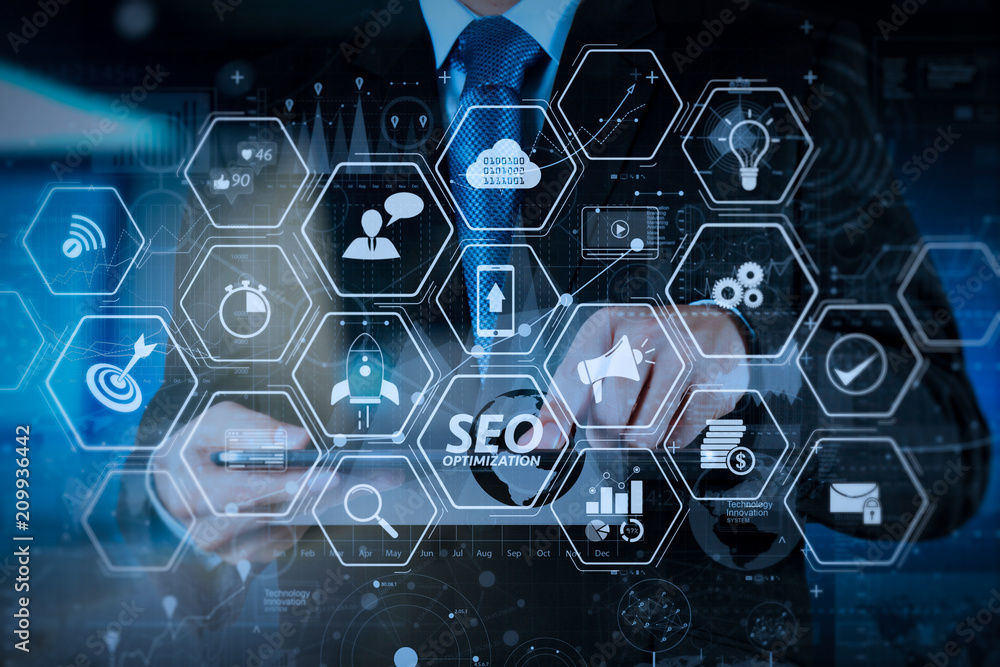 Fototapeta premium businessman hand working with modern technology and digital layer effect as business strategy concept
