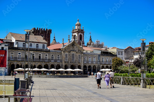 View from the Plaza de la Republica in the center of the city to its historic buildings and the Castillo de Braga, also to some restaurants in the area, photo taken in Braga, Portugal. photo