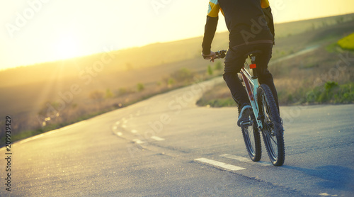 Fototapeta Naklejka Na Ścianę i Meble -  Ride on bicycle on the road. Sport concept and idea