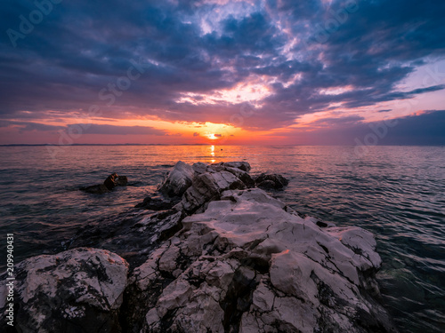 Wideangle photo of sunset with beautiful rocks and Adriatic sea, Vir, Zadar county, Croatia