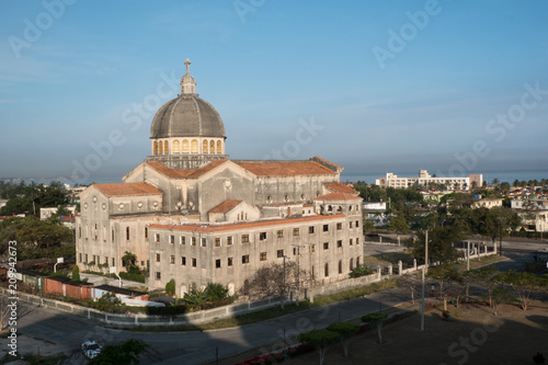 Exterior of the Iglesia de Jesús de Miramar (Church of Jesus of Miramar) in Havana, Cuba in the early morning as the sun coming up. Ocean in the background.