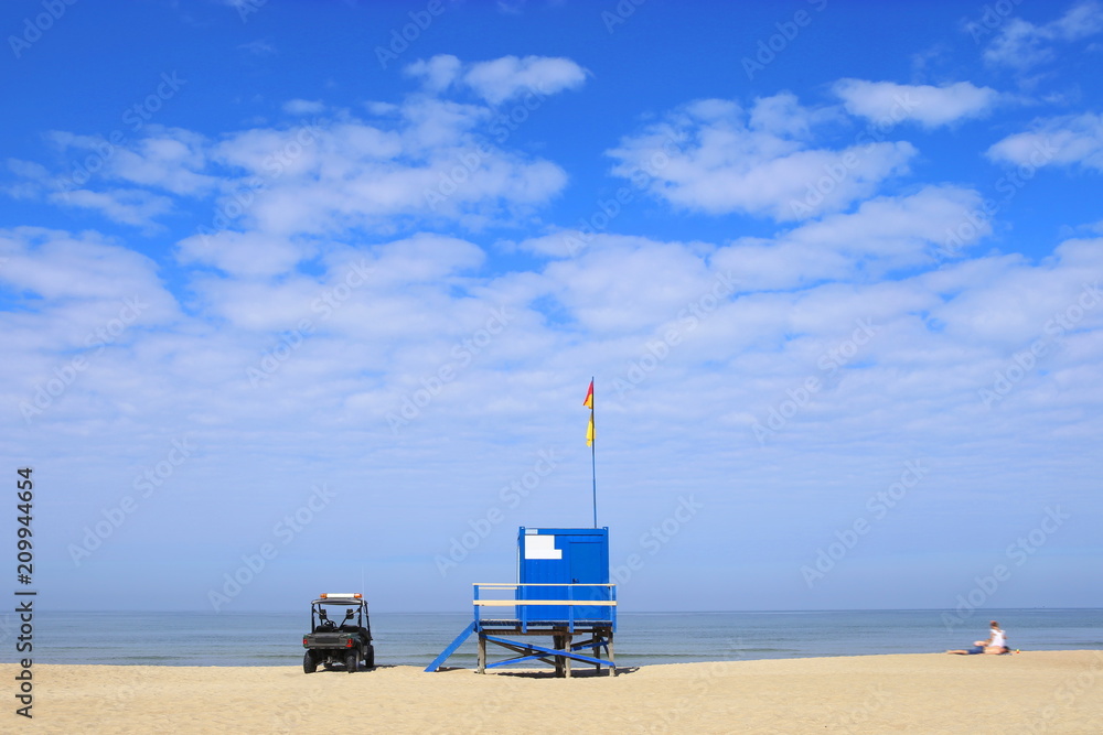 Lifeguard tower and car on the beach. Lifeguard cabin on Baltic sea beach in Lithuania. Lifeguard tower and car on the beach. Lifeguard cabin on Baltic sea beach in Lithuania.