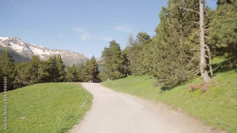 Driving in windy mountain offroad track in the Pyrenees Catalonia Spain Driving in windy mountain offroad track in the Pyrenees Catalonia Spain