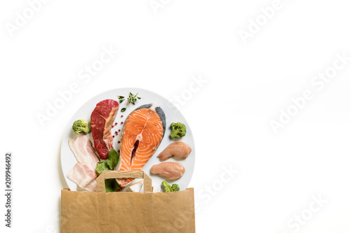 Different meat and fish on white background.