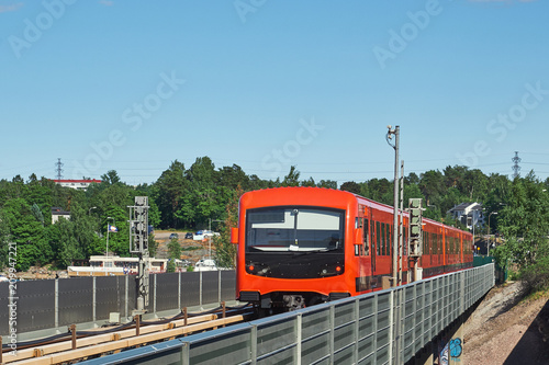 modern metro train on the bridge 