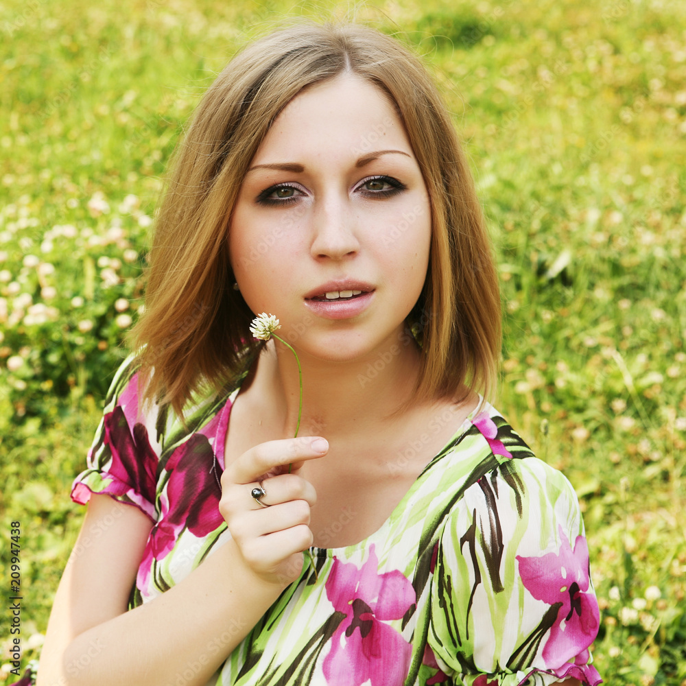 young woman relaxing in the grass young woman relaxing in the grass