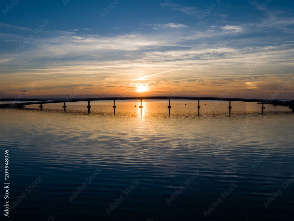 Sunset behind bridge on island Vir, bridge over Adriatic sea
