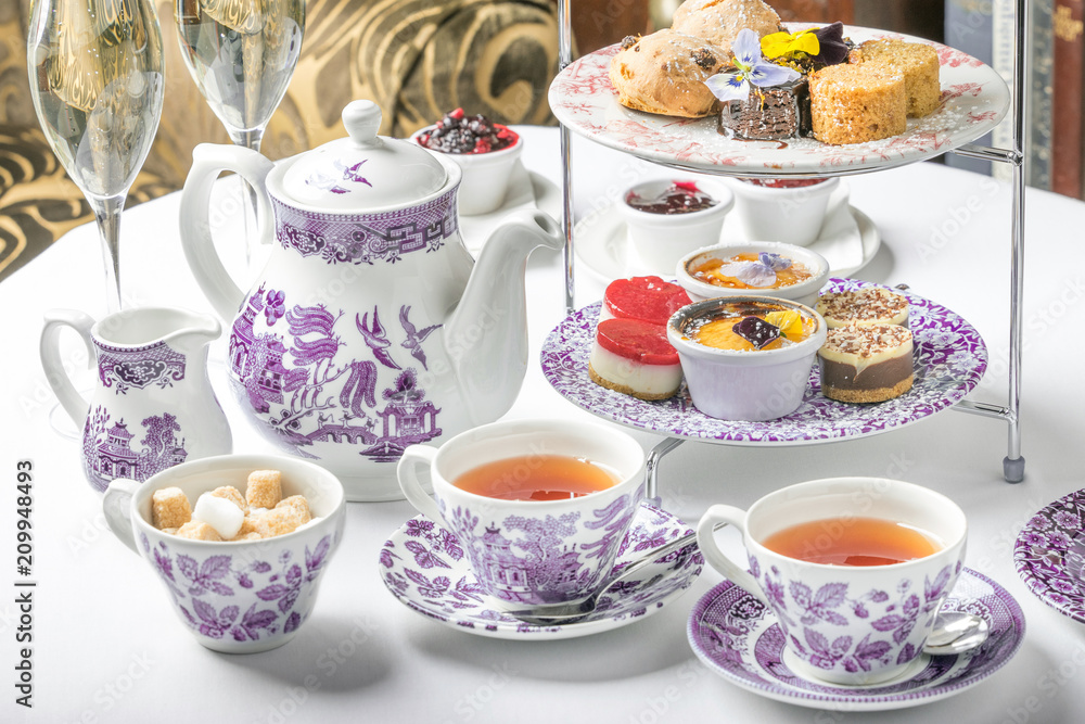 old school style tea at five afternoon service sandwich set cake sweet traditional table hotel cheesecake sugar pot china cup