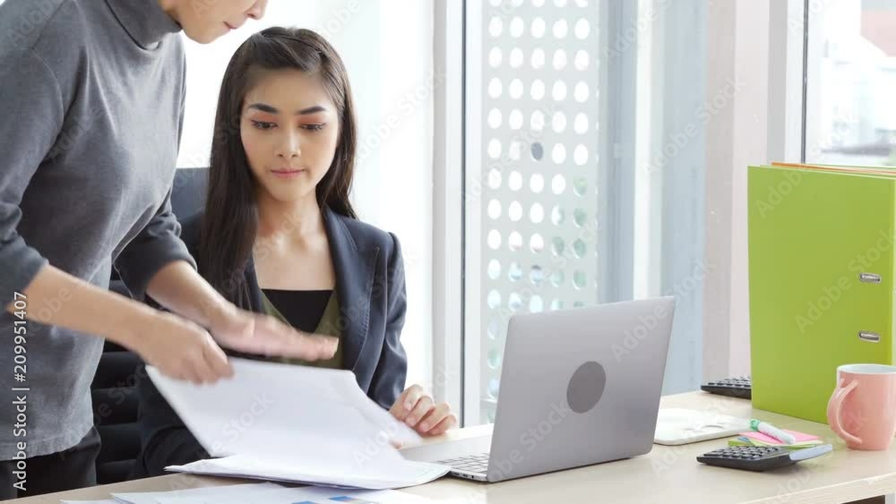 Asian woman work with stress situation. Manager angry her for mistake work. Asian woman work with stress situation. Manager angry her for mistake work.