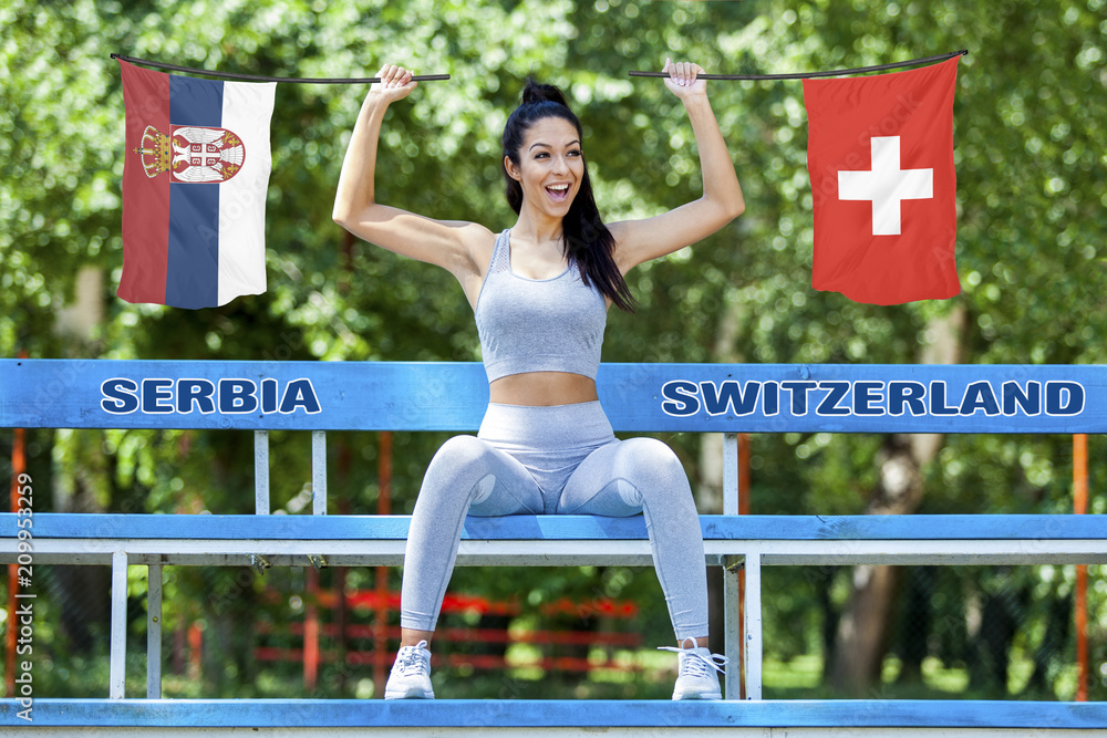 Flags of Serbia and Switzerland being held by beautiful sexy girl Stock  Photo | Adobe Stock