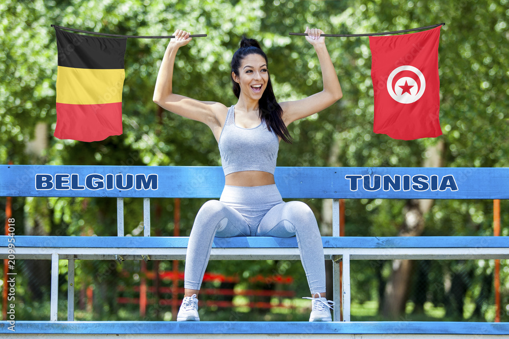 Flags of Belgium and Tunisia being held by beautiful sexy girl foto de  Stock | Adobe Stock