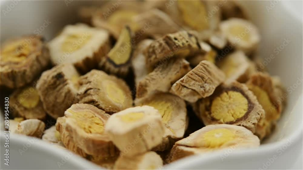 Chinese herb medicine of Isatidis Radix or Indigowoad Root rotating close up Chinese herb medicine of Isatidis Radix or Indigowoad Root rotating close up