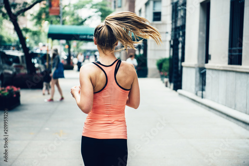 Woman running on New York City street at the morning