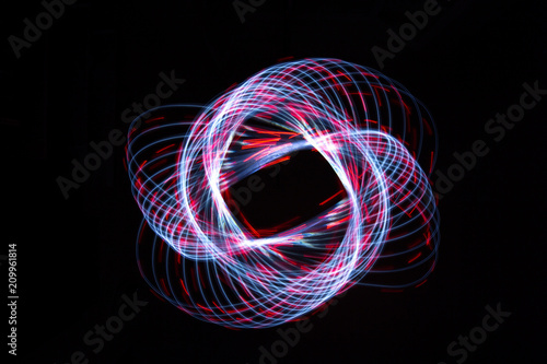 Light painting forming a dashed flower star shape photo