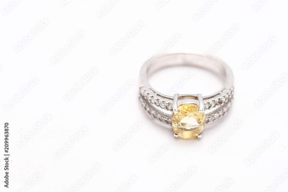 Yellow gem stone on diamond ring Yellow gem stone on diamond ring