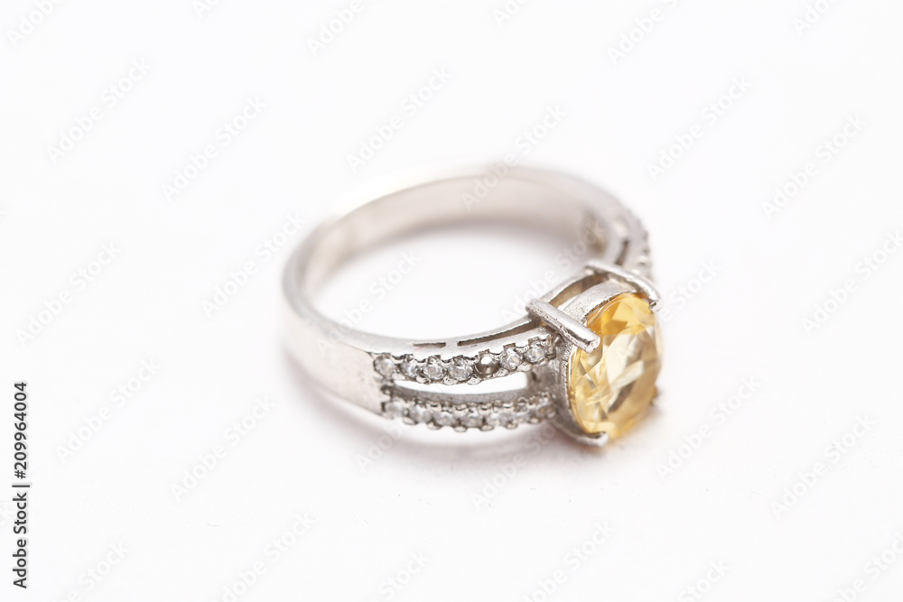 Yellow gem stone on diamond ring Yellow gem stone on diamond ring